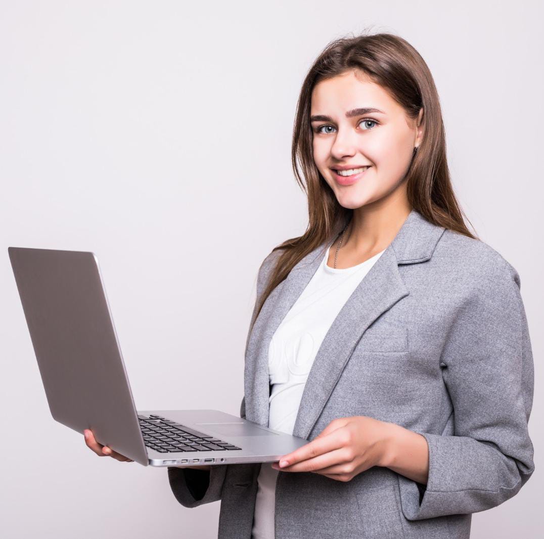 Image of student holding laptop